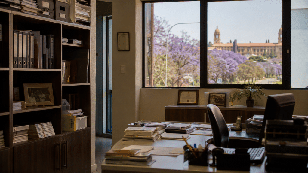 SEO Pretoria context — a capital-city office interior with the Union Buildings visible through the window