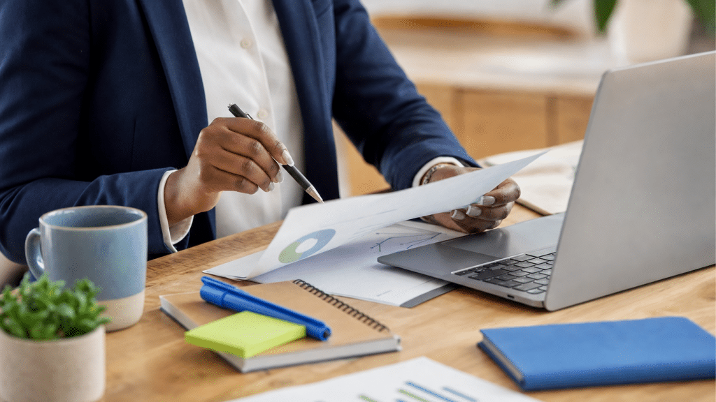 website project brief template south africa — professional reviewing website planning documents at desk