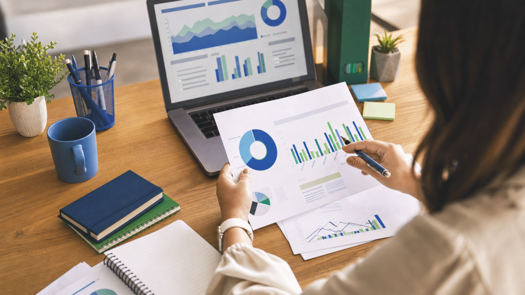 youtube advertising cost south africa — marketing professional reviewing video ad performance charts at a desk