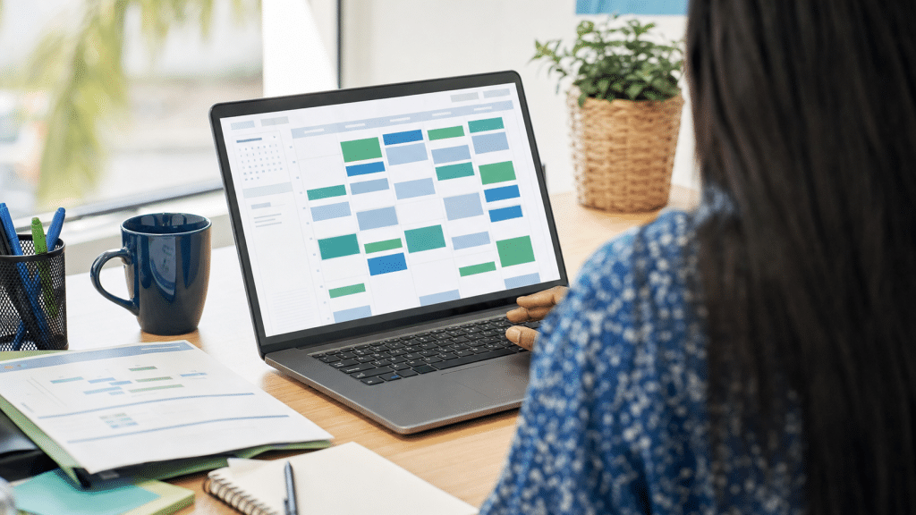 calendly vs microsoft bookings — professional comparing scheduling tools on a laptop in a South African office
