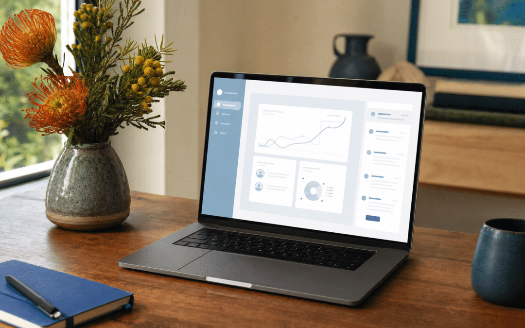 website design for guesthouses — laptop and florals on a guesthouse desk