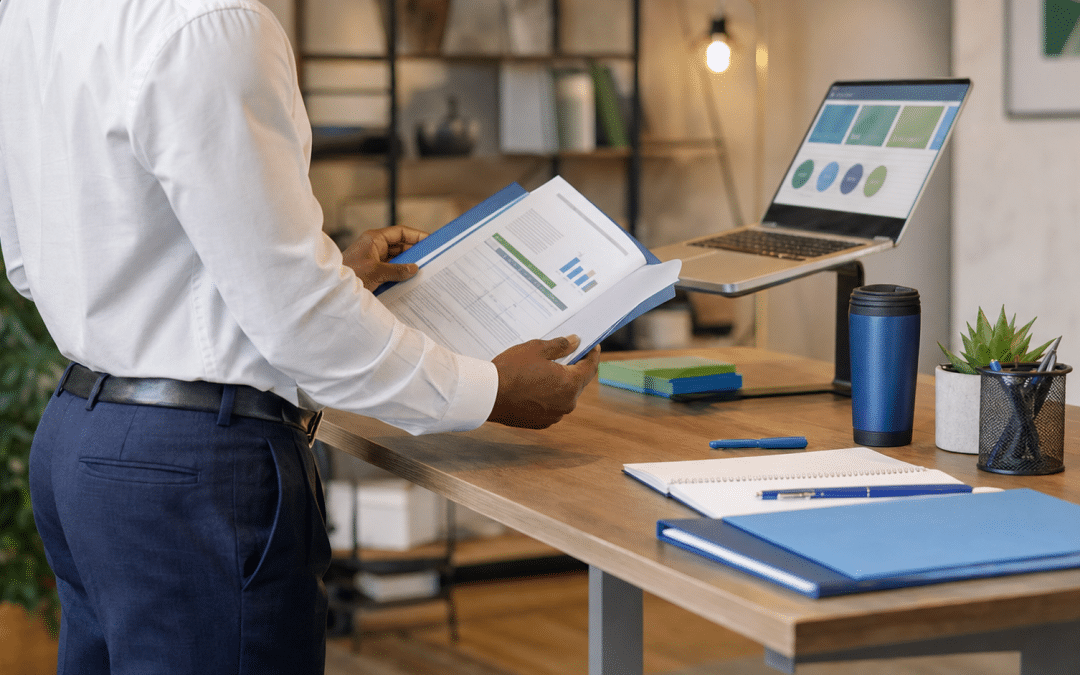 b2b buyer journey South Africa — business professional reviewing procurement brief at standing desk
